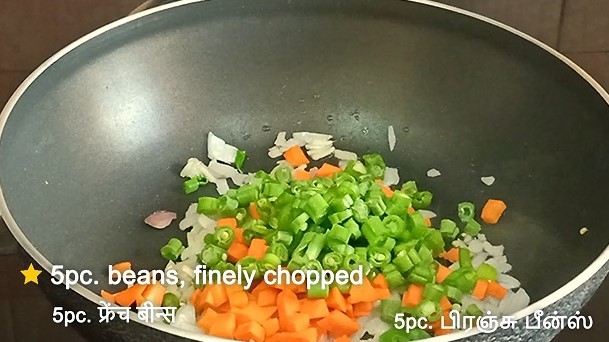 veg fried rice frying beans, carrot in chopped onion